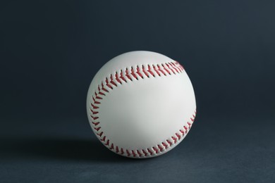 Photo of Baseball ball on dark background, closeup. Sports game