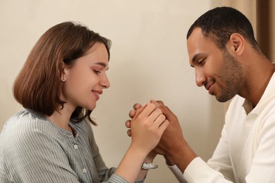 Photo of Romantic date. Happy couple spending time together indoors