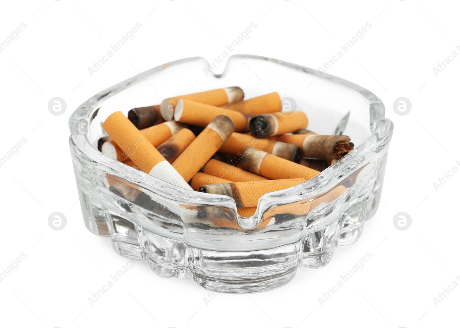 Photo of Glass ashtray with cigarette stubs isolated on white