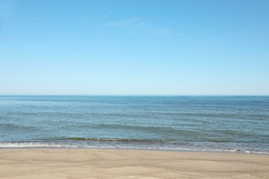 Picturesque view of sandy beach near sea