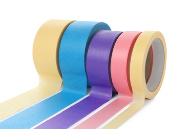 Photo of Many different rolls of adhesive tape on white background