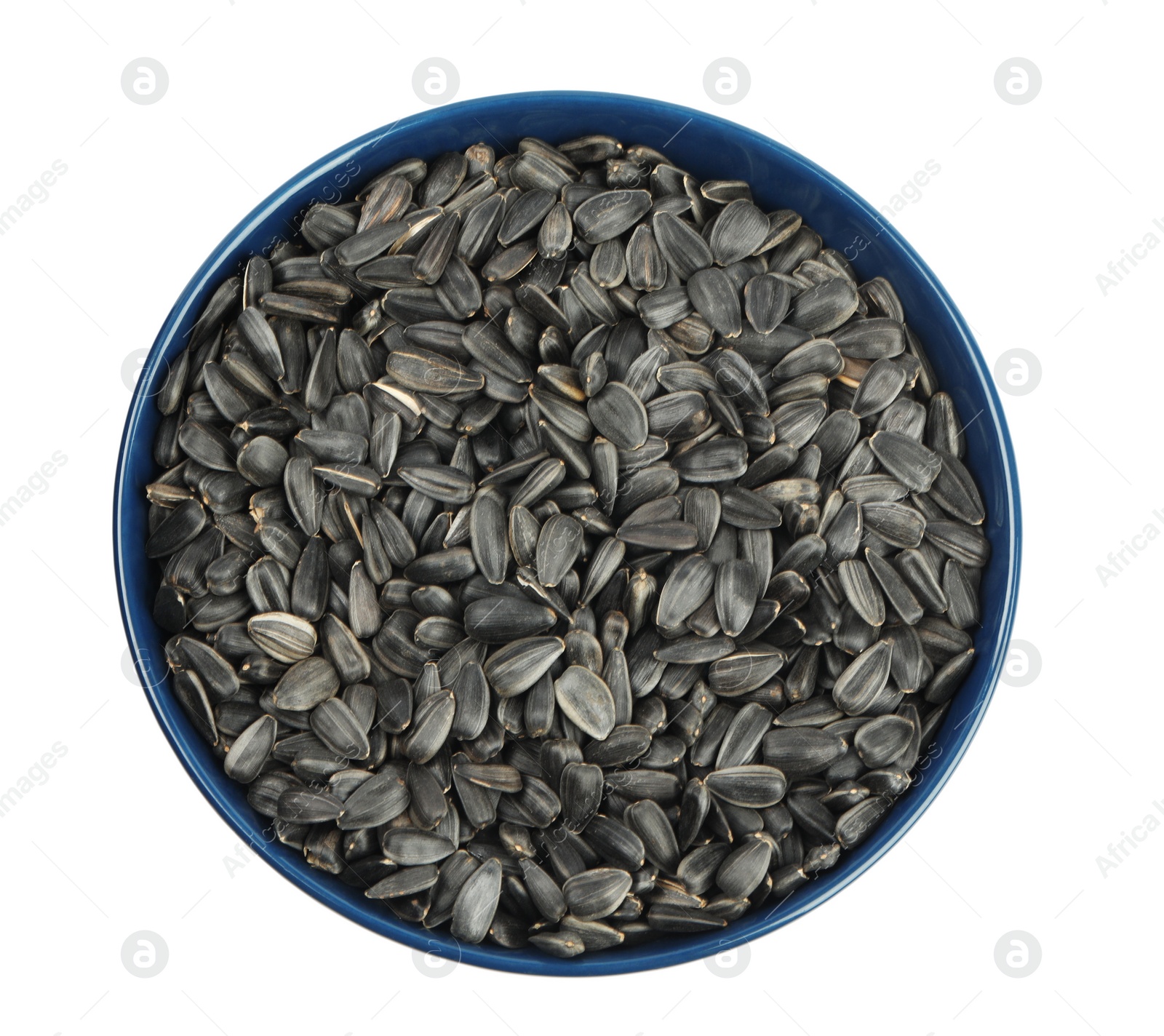 Photo of Sunflower seeds in bowl isolated on white, top view