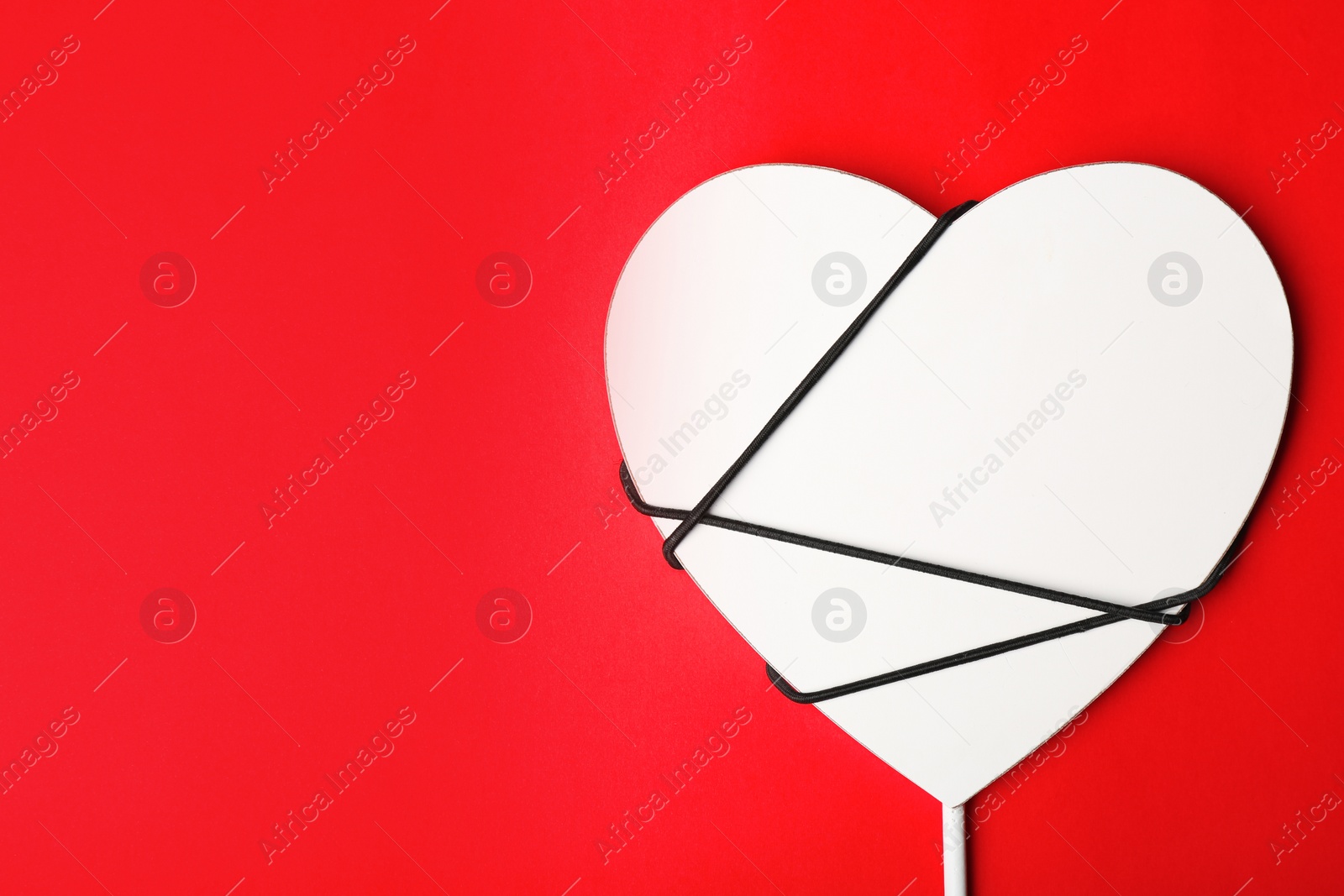 Photo of Decorative heart on color background, space for text