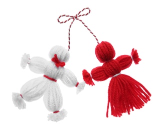 Traditional martisor shaped as man and woman on white background. Beginning of spring celebration