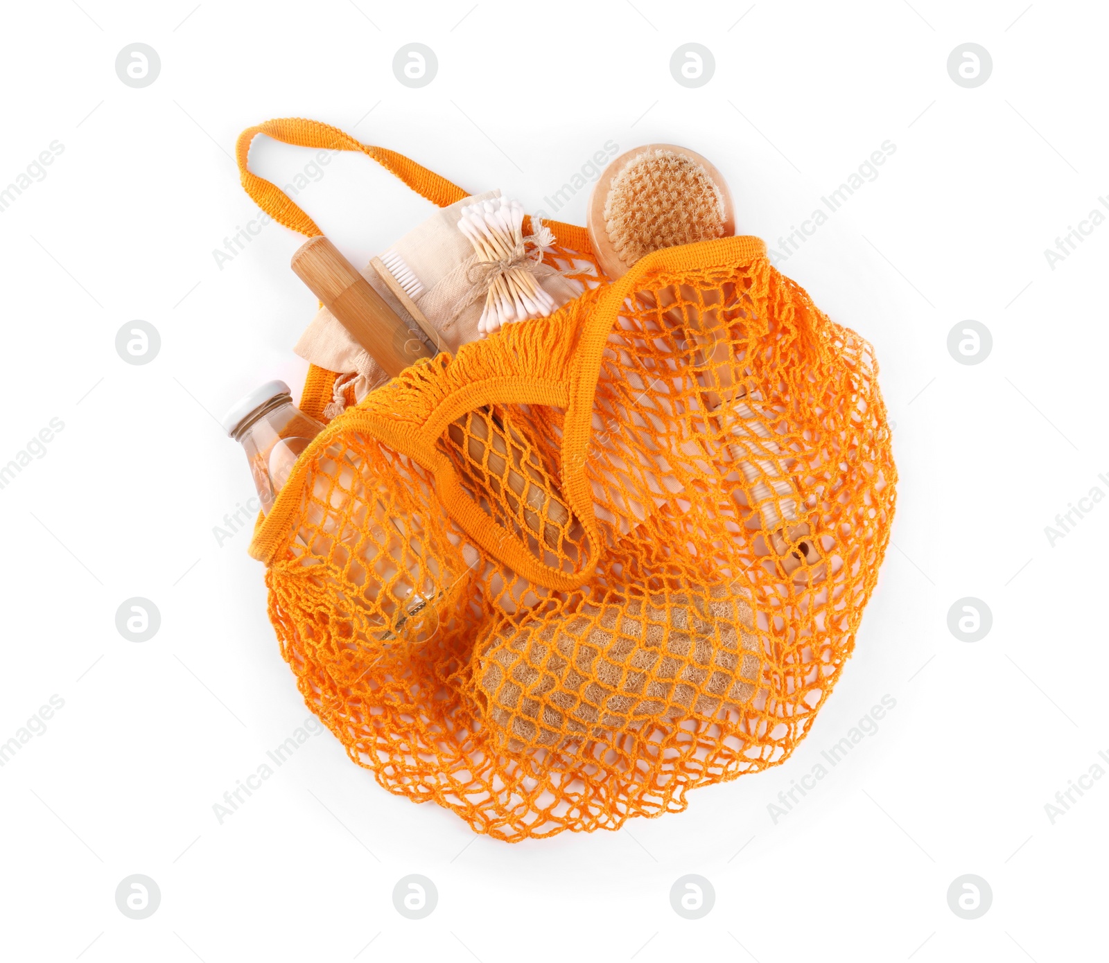 Photo of Mesh bag with different items isolated on white, top view. Conscious consumption