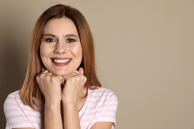 Smiling woman with perfect teeth on color background. Space for text