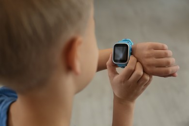 Photo of Boy with stylish smart watch, closeup view