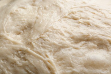 Photo of Fresh yeast dough as background, closeup view