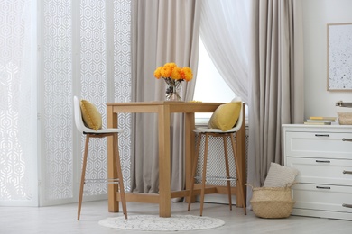 Photo of Beautiful curtains on window in stylish room interior