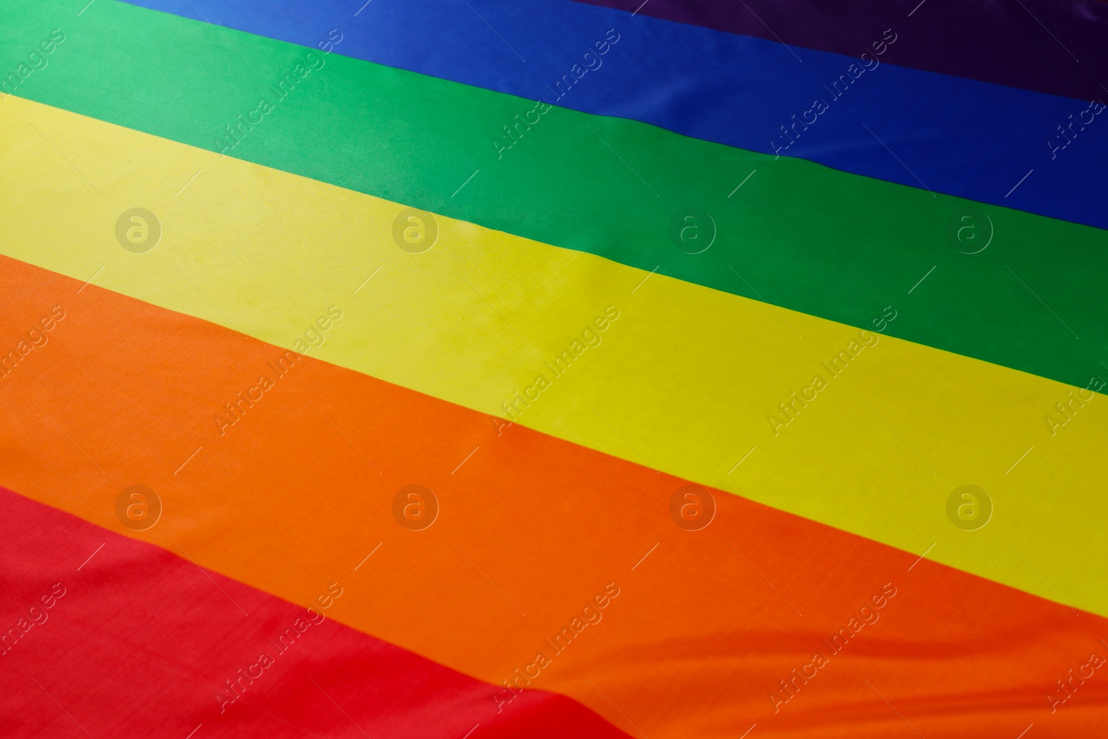 Photo of Rainbow LGBT flag as background, closeup view