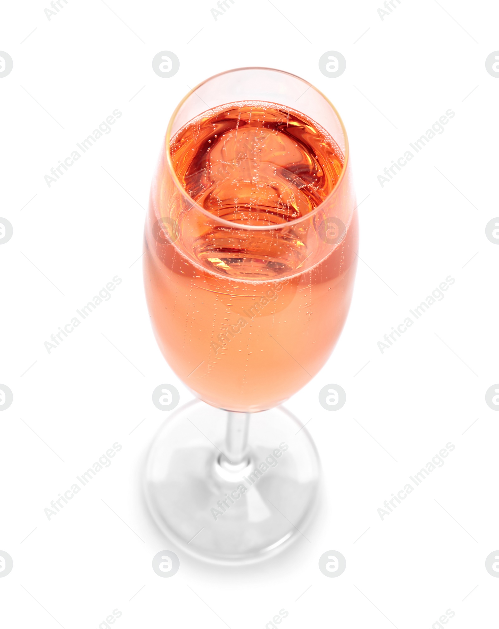 Photo of Glass of rose champagne on white background. Festive drink