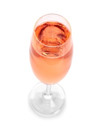 Photo of Glass of rose champagne on white background. Festive drink