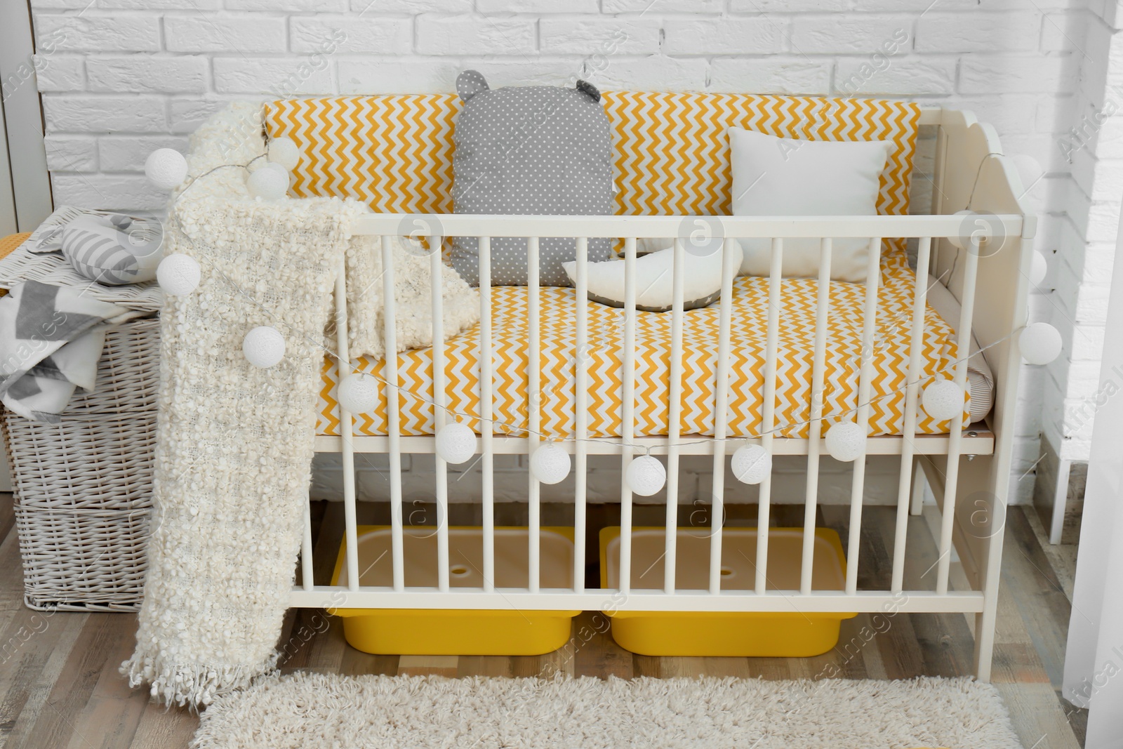 Photo of Stylish baby room interior with crib