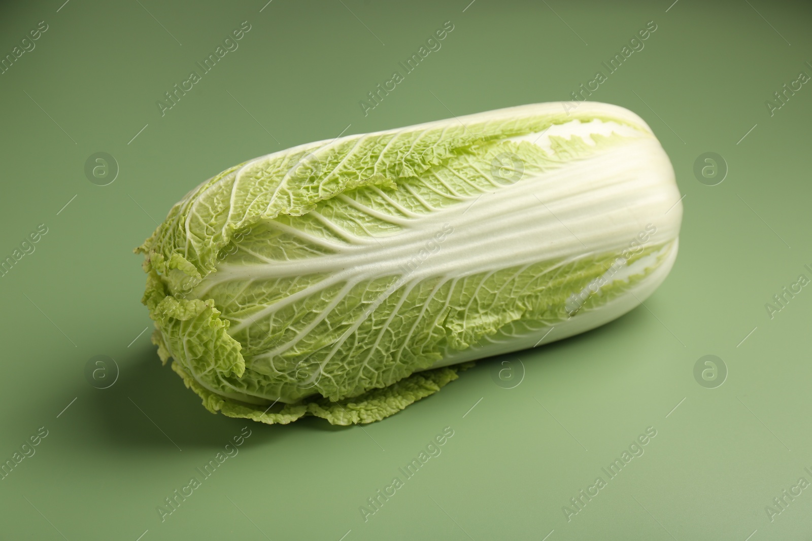 Photo of Fresh ripe Chinese cabbage on pale green background