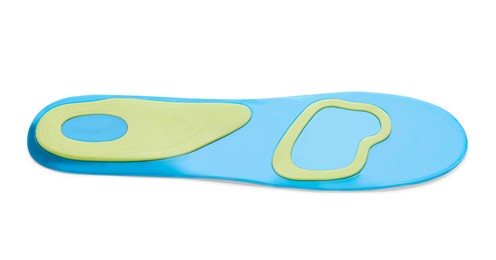 Photo of Light blue orthopedic insole isolated on white