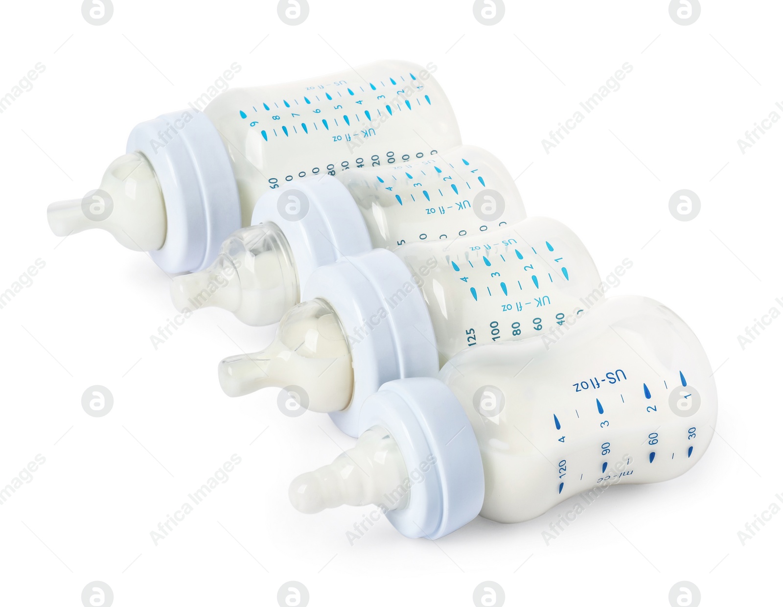 Photo of Feeding bottles with milk on white background