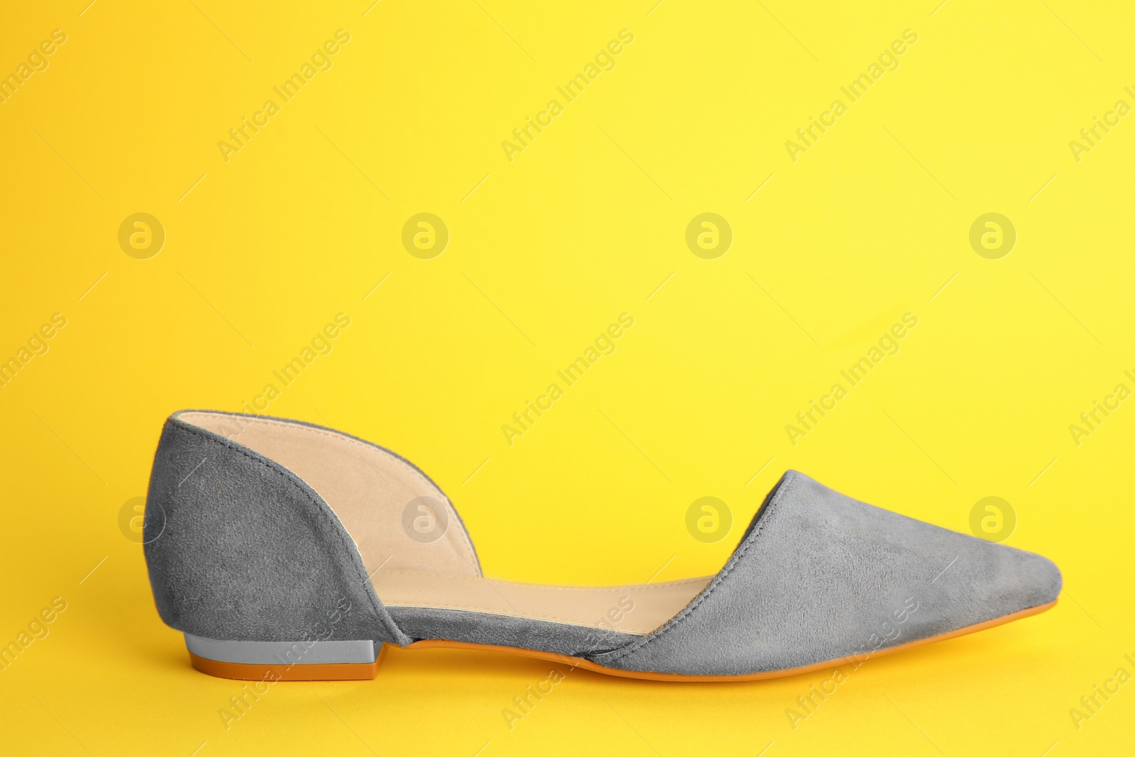 Photo of Female shoe on color background