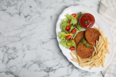 Photo of Delicious fried breaded cutlets with garnish served on white marble table, top view. Space for text