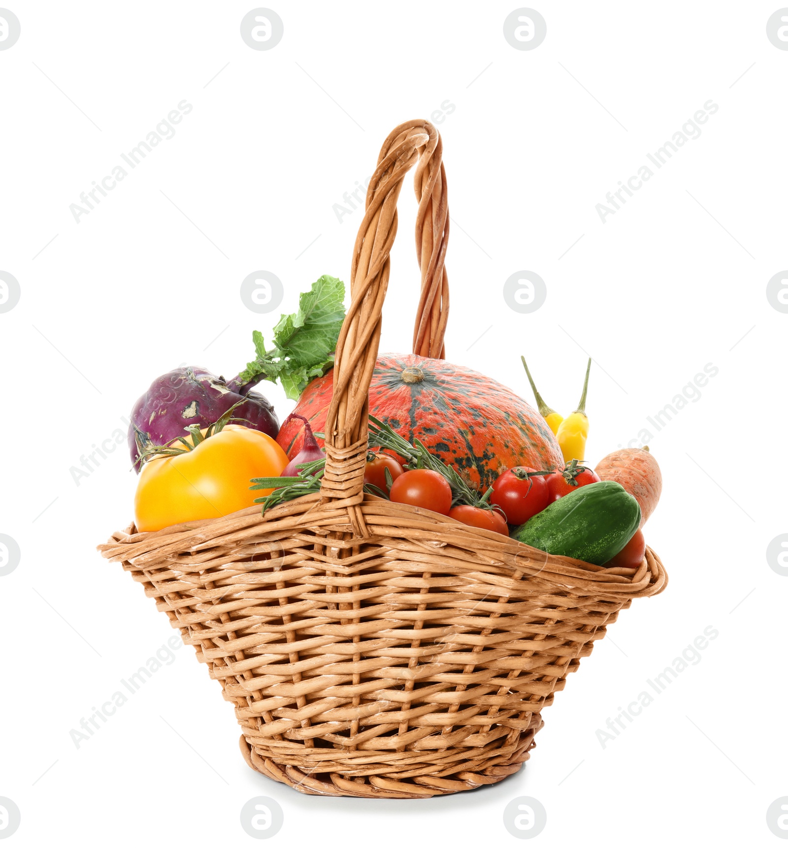 Photo of Fresh ripe vegetables in wicker basket on white background