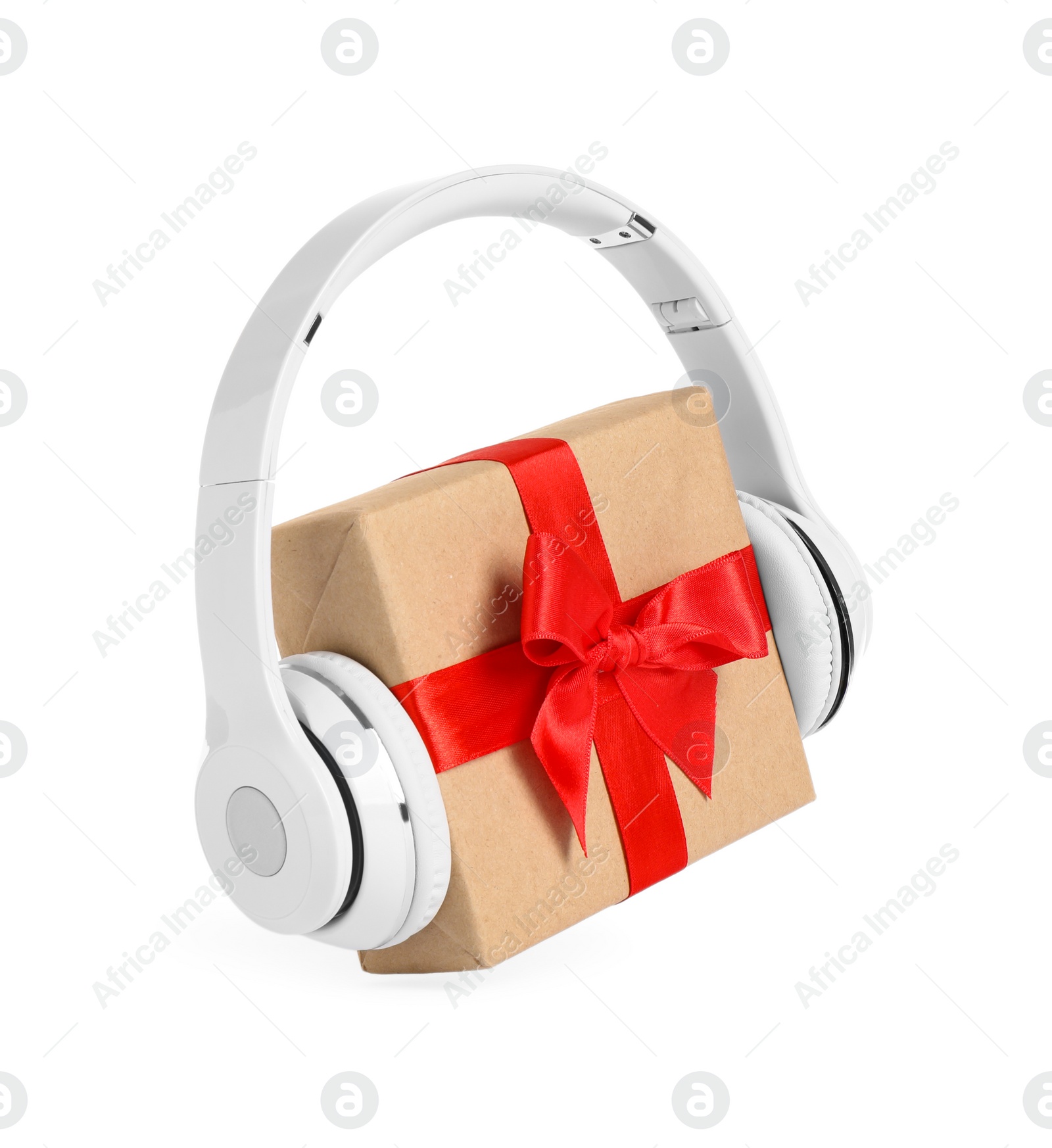 Photo of Gift box with headphones isolated on white. Christmas music concept