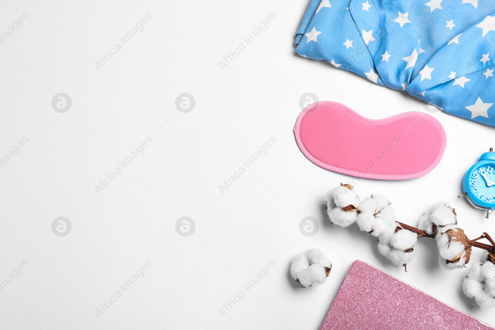 Photo of Composition with sleeping mask on white background, top view. Bedtime accessories