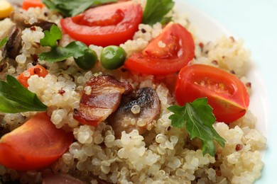 Photo of Tasty quinoa porridge with fried bacon, mushrooms and vegetables on plate, closeup