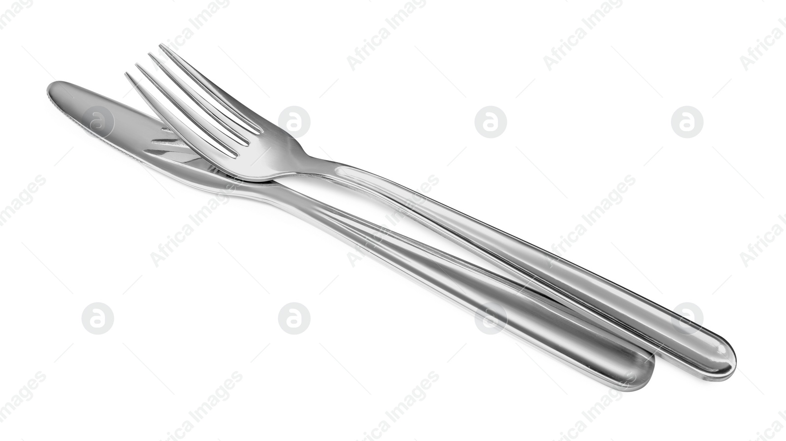 Photo of Fork and knife isolated on white. Stylish shiny cutlery set