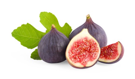 Photo of Whole and cut ripe figs with green leaf isolated on white