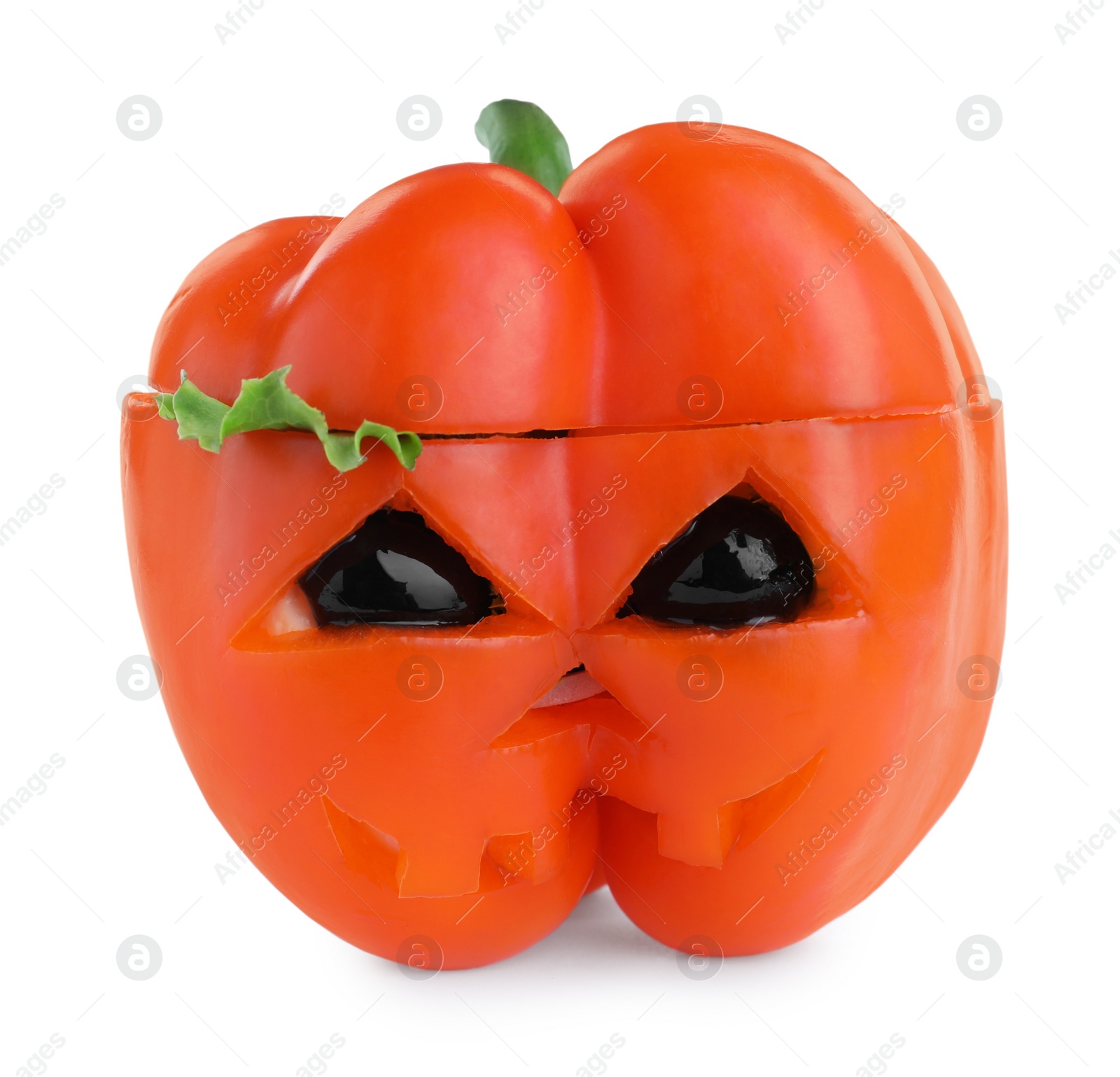 Photo of Bell pepper with black olives and lettuce as Halloween monster isolated on white