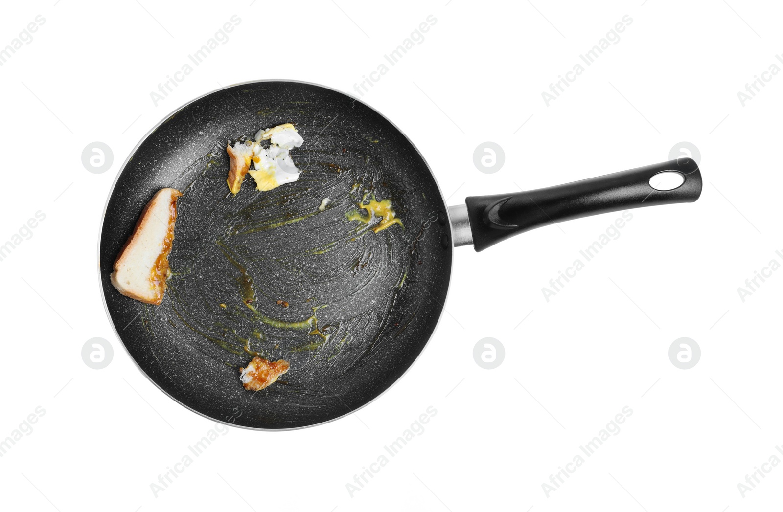 Photo of Dirty non-stick frying pan on white background, top view