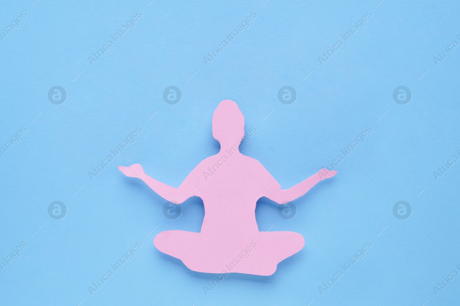 Photo of Woman`s health. Paper female figure on light blue background, top view