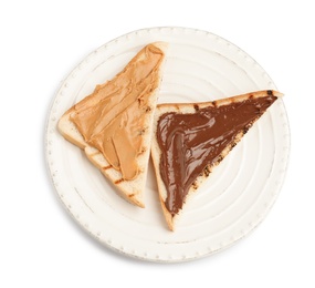 Slices of bread with different spreads on white background, top view