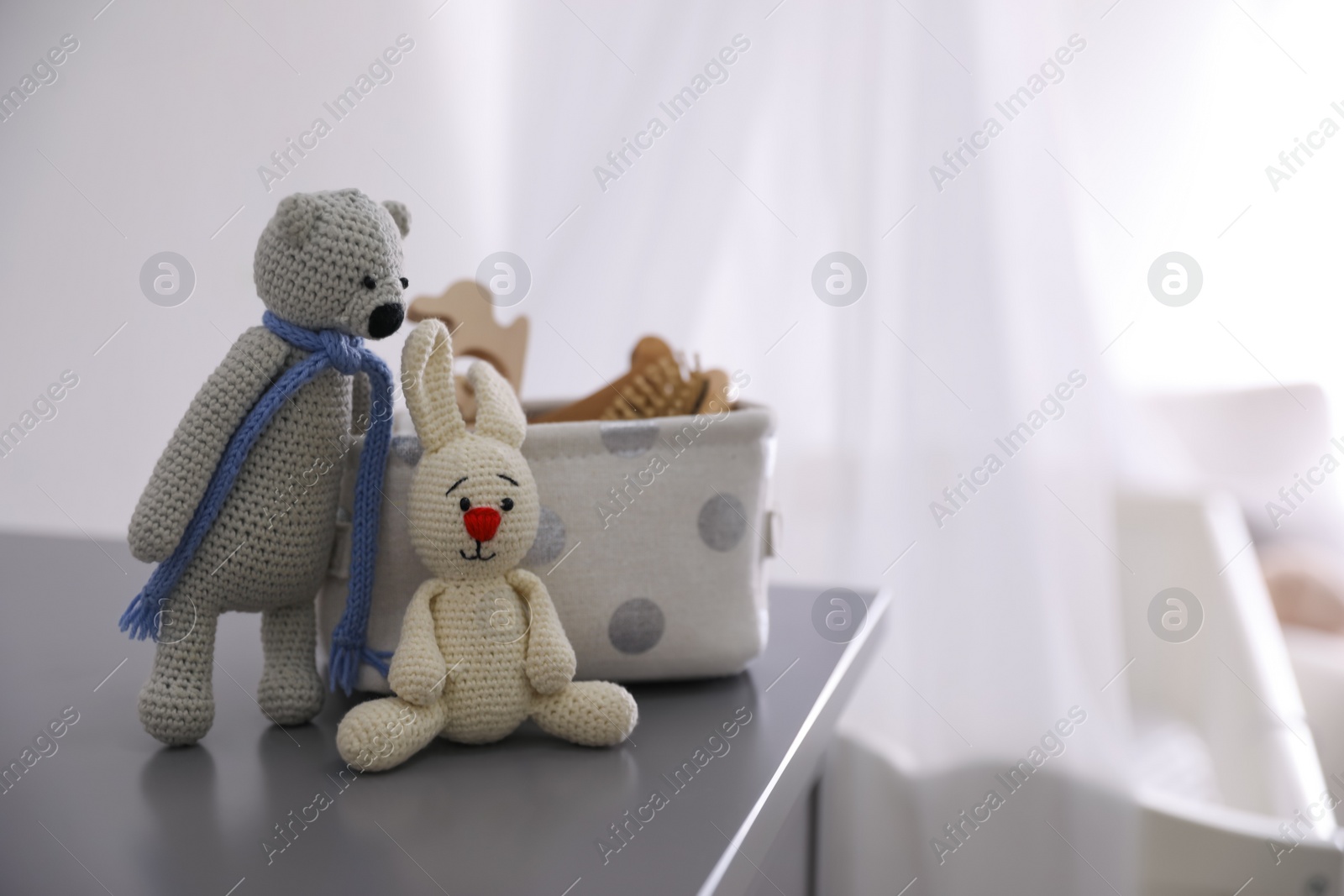 Photo of Toys on table in baby room, space for text