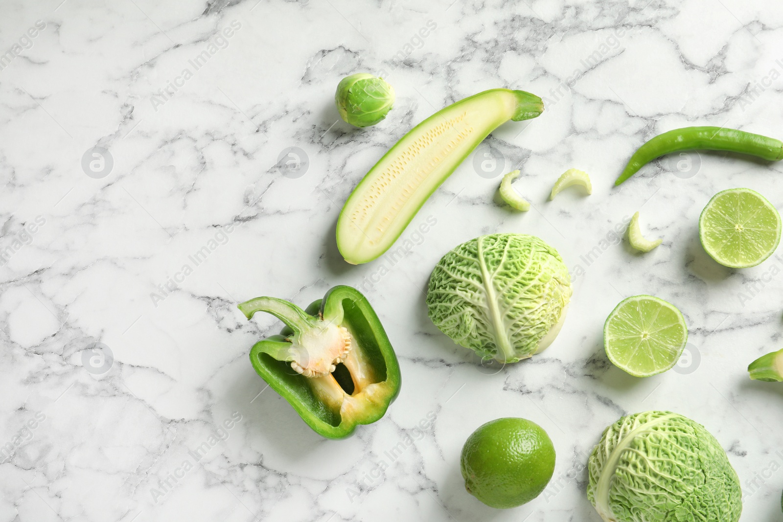 Photo of Flat lay composition with fresh vegetables and fruit on marble background