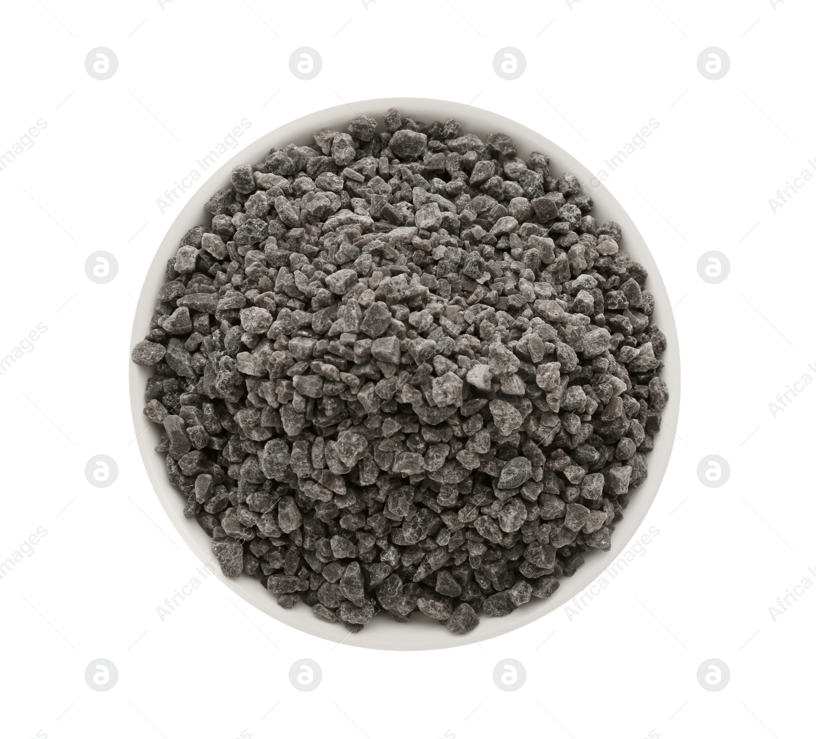 Photo of Black salt in bowl isolated on white, top view