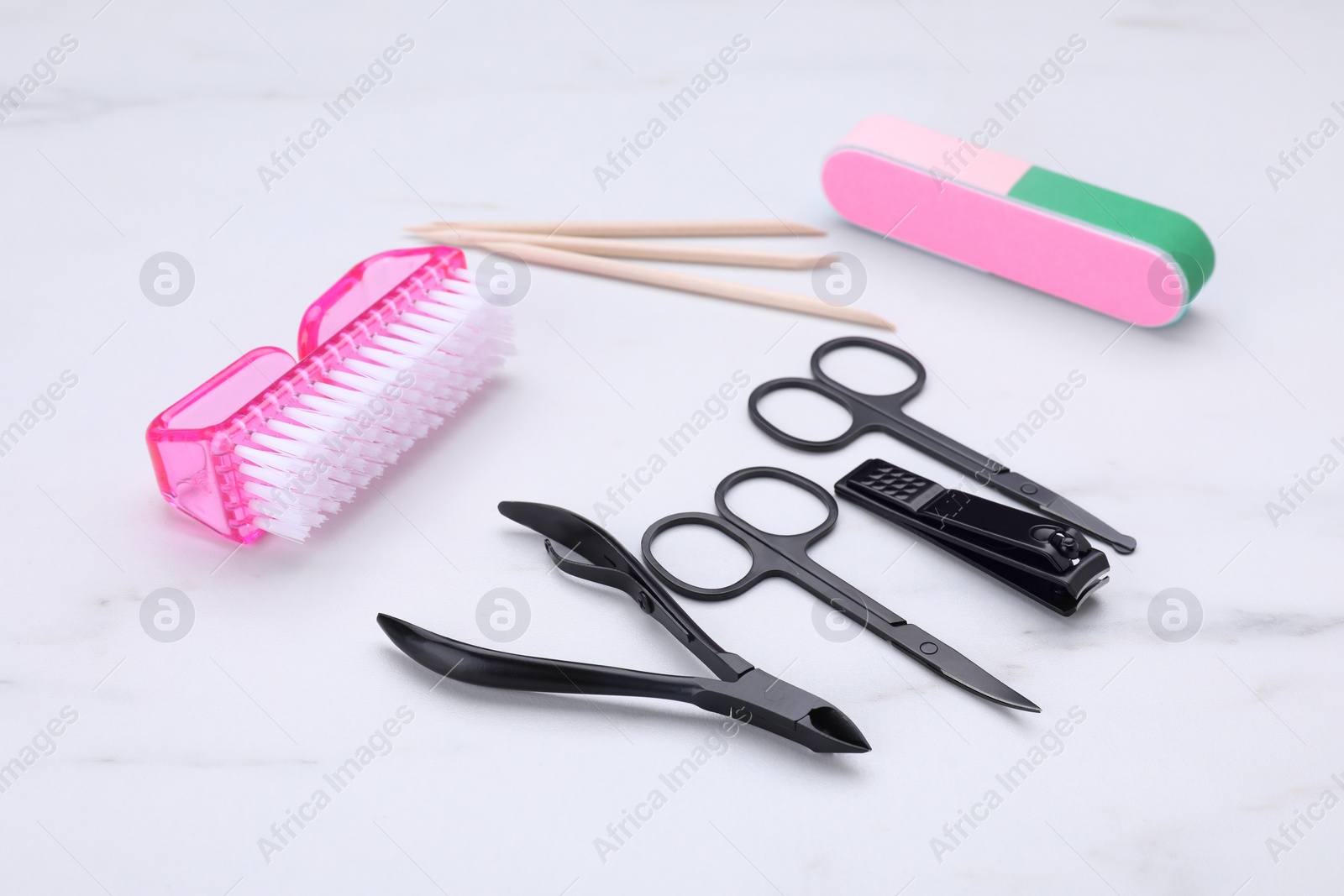 Photo of Set of pedicure tools on white table