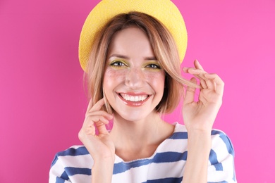 Beautiful young woman posing on color background. Summer fashion