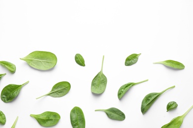 Photo of Fresh green healthy spinach leaves on white background, top view