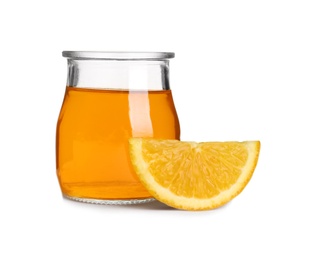 Slice of orange and tasty jelly dessert in glass jar on white background