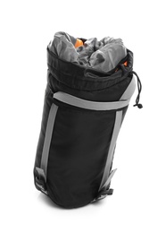 Photo of Sleeping bag in case on white background. Camping equipment