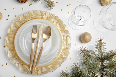 Photo of Elegant table setting on light background, top view. Christmas celebration