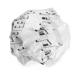 Photo of Crumpled sheet of paper with musical notes isolated on white