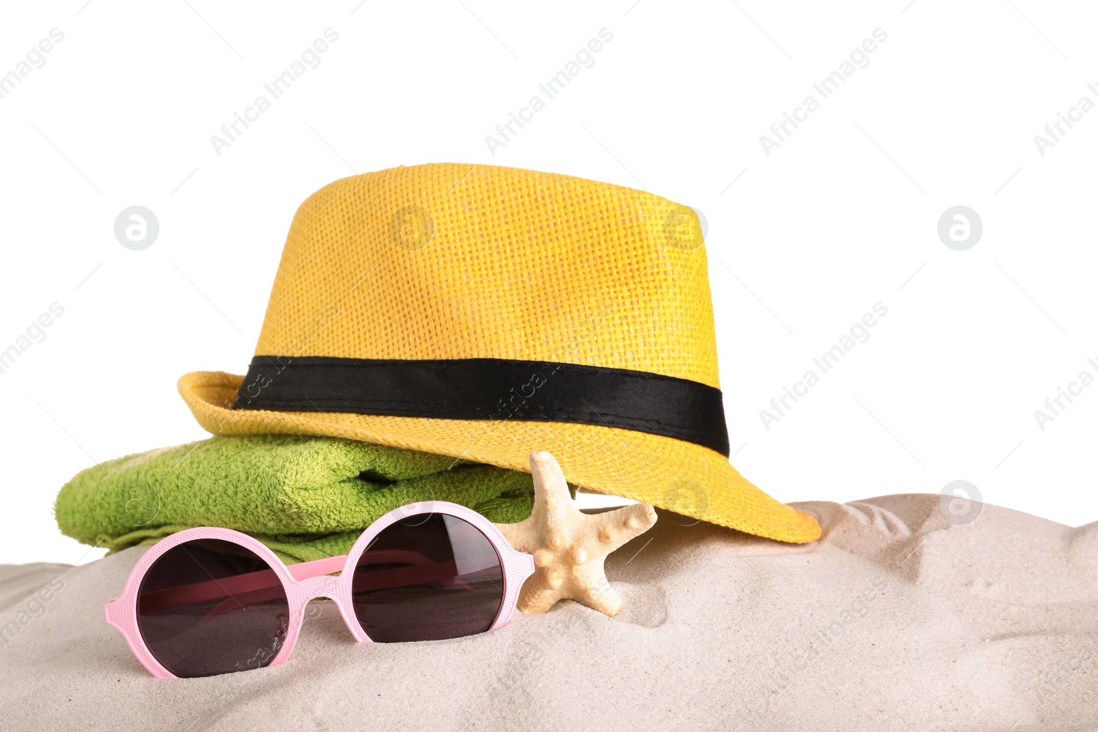 Photo of Beach accessories on sand against white background. Space for text