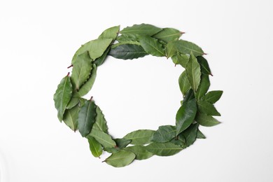 Photo of Frame made of many fresh bay leaves on white background, top view. Space for text
