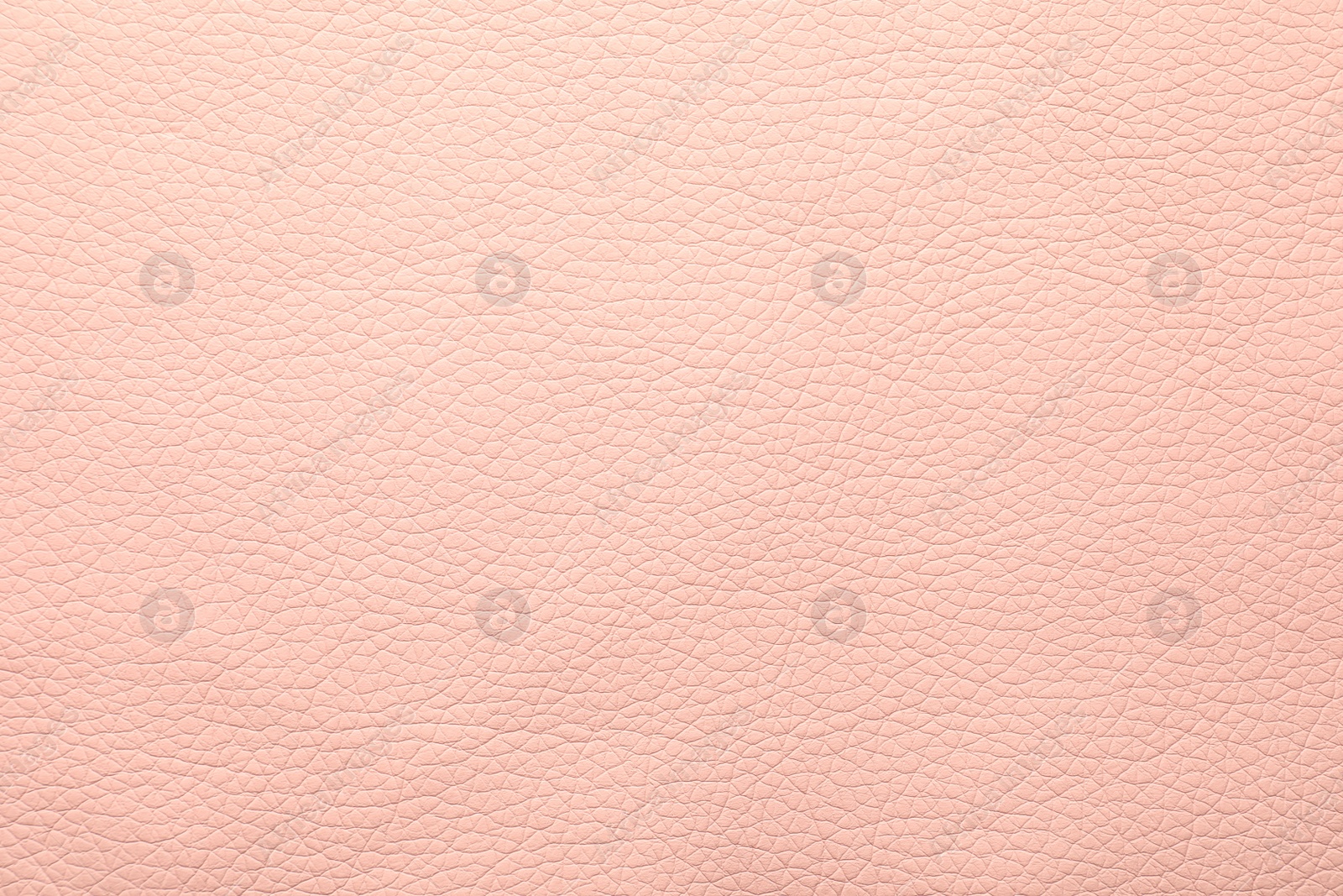 Photo of Texture of light pink leather as background, closeup