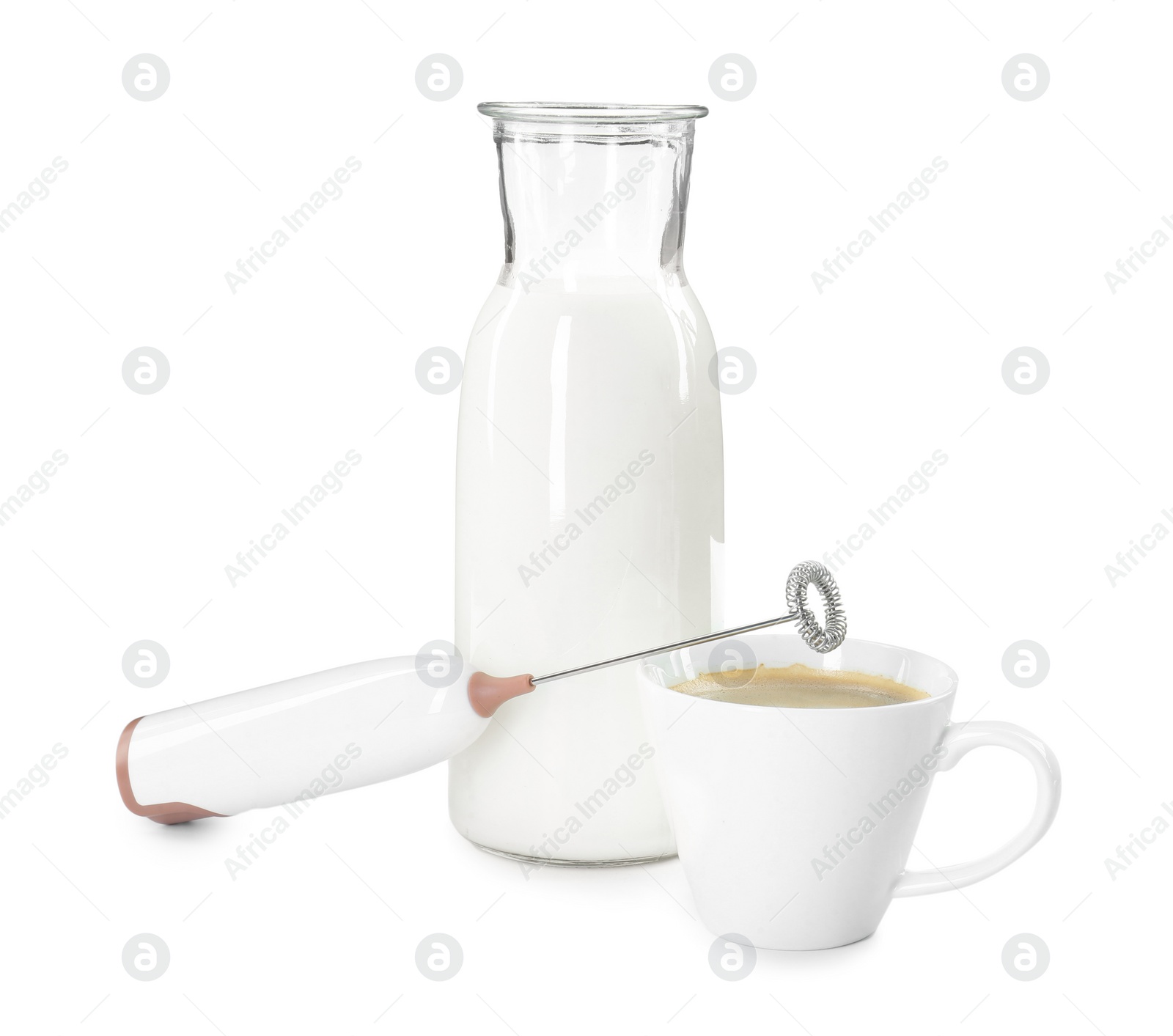 Photo of Mini mixer (milk frother), cup of coffee and bottle isolated on white