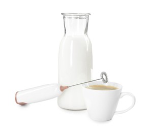 Mini mixer (milk frother), cup of coffee and bottle isolated on white