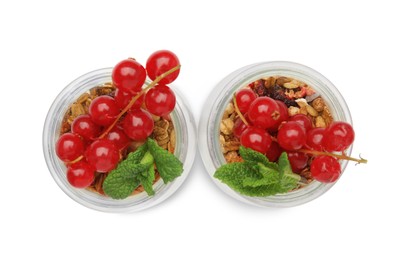 Photo of Delicious yogurt parfait with fresh red currants and mint on white background, top view