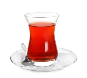 Photo of Glass of traditional Turkish tea with spoon isolated on white