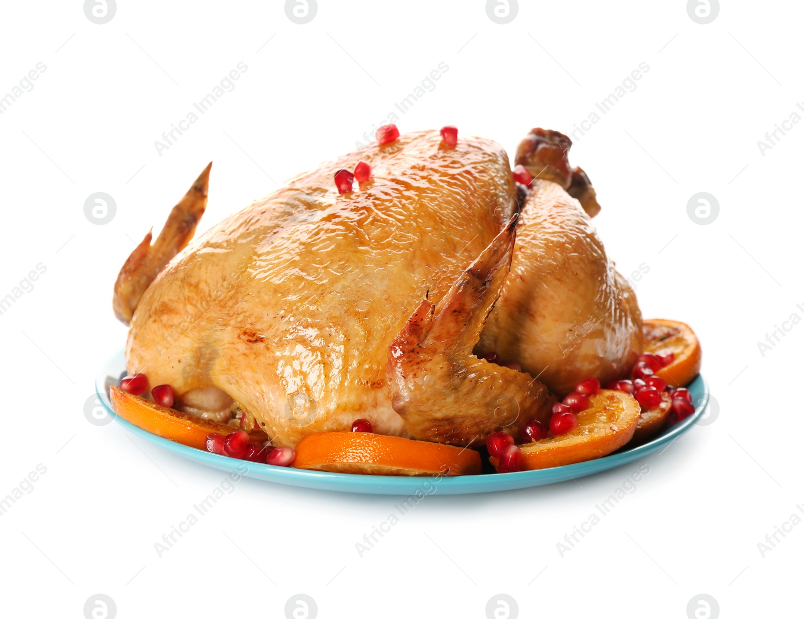 Photo of Roasted chicken with oranges and pomegranate isolated on white